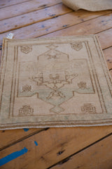Softened pile and distressed ivory, seafoam green Oushak corner with fringe.