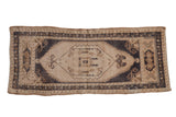 Distressed vintage Oushak mat runner with ivory central medallion and navy blue accents. 1'9