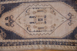 Distressed short pile Oushak runner, ivory field, navy blue border, coffee brown motifs.