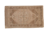 Hand knotted vintage Oushak rug, distressed beige and coffee, hexagonal medallion, floral motifs.