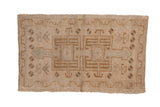 Distressed vintage Oushak rug mat with double medallion and muted cream, beige floral designs.
