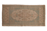 Vintage Distressed Oushak rug runner, a dusty seafoam green and sand geometric medallion, 1'9