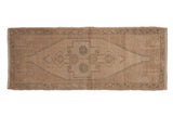 Vintage distressed Oushak runner, muted beige with faded seafoam green medallion, 1'6