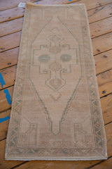 Distressed hand-knotted Oushak runner, abrash beige, geometric seafoam green medallion, even wear, 1'6