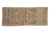 Distressed Oushak runner with lightning serrated medallion, palmettes, cream and seafoam green.