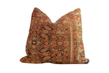 Vintage Persian rug fragment throw pillow with rust coral, seafoam, ivory geometric pattern. 24x24.