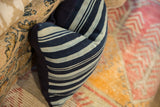Vintage Indigo African throw pillow, textured blue stripes, and navy linen backing.