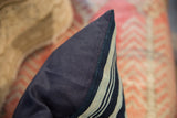 Vintage African textile throw pillow with striped indigo front and navy linen blend backing.