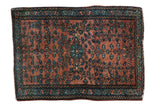 Collector's Farahan Sarouk rug with a central medallion and blue floral blossoms on a dusty copper field.