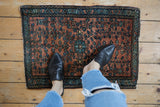 Vintage Farahan Sarouk rug mat shown to scale with a dusty copper field and blue floral pattern.