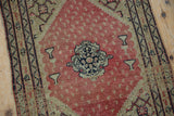 Floral medallion and unusual hookah motifs on a fine antique Persian Senneh rug.