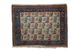 Vintage Northwest Persian bagface rug with a pictorial human motif on an ivory field and a detailed blue floral border.