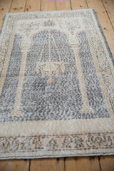 Angled perspective of a distressed Sparta rug highlighting its worn prayer design.