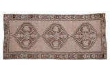 Vintage Oushak runner, distressed triple geometric floral medallions in faded ivory and chestnut. 4'8