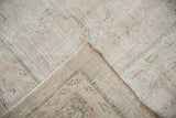 Worn distressed pile and woven foundation detail of the vintage Oushak carpet.