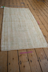 Hand knotted vintage Oushak runner showing distressed texture, visible foundation, intact selvage.
