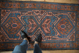 Vintage Mehreban rug's oversized medallions and intricate field in sky blue, madder, and blush.