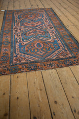 Geometric patterns, sky blue side selvage, and rust border on a vintage Mehreban rug.