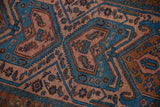 Vintage Mehreban rug section with intricate sky blue, pale raspberry, and chestnut motifs.