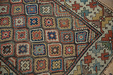 Nuanced diamond lattice field and unique crab gul border on the antique Caucasian runner.