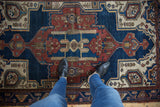 Vintage Hamadan rug with oversized center medallion, geometric floral design, and even pile wear.