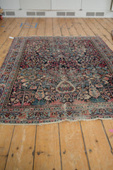 Vintage Persian Meshed rug, displaying tree of life design, blossoms, and tattered edge.