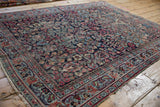 Vintage Meshed rug detail: classic tree of life motif, rich colors, and worn edges.