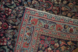 Worn navy blue field with red blossoms alongside the powder blue floral border.