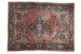 Vintage Heriz carpet, concentric diamond medallion, floral field, samovar border in red, navy, ivory.