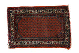 Hand-knotted vintage Engelas rug mat with madder rust field, boteh design, and ivory vine border.
