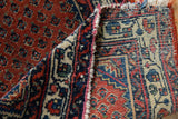Vintage Engelas rug detail, showing hand-knotted construction, rust pile, and patterned reverse foundation.