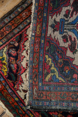 Fringe and hand-knotted side cording of the Dargezine rug, showcasing its vivid geometric border.