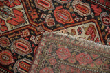 Close-up of Vintage Malayer runner's cherry red, blue worn pile and fringed foundation.