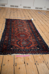 Vintage Lilihan runner corner with raspberry red field, sapphire blue border, and Herati motifs.