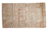 Hand-knotted distressed vintage Oushak rug with faded red, beige geometric plant patterns, 4'6