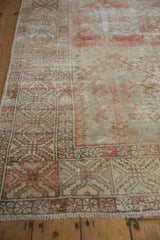 Faded geometric patterns and distressed texture on this vintage Oushak rug detail.