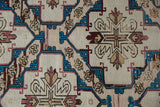 Distressed Turkish Soumac rug detail with sapphire blue, raspberry geometric patterns, and abrashes.