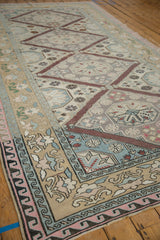 Vintage Distressed Turkish Soumac design carpet borders with pink wave and germinating plant motifs.