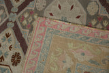 Hand-woven Soumac rug detail with distressed pink, powder blue border and geometric patterns.