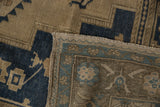 Vintage Distressed Oushak carpet showing dusty beige pile, selvage, and woven reverse.