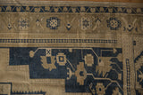 Vintage Oushak rug border, dusty beige and navy blue geometric floral motifs.