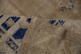 Vintage Distressed Oushak rug detail showing low pile, cobalt blue pattern, and woven selvedge.