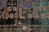 Distressed vintage Oushak rug detail, worn pile revealing foundation, with teal, violet, black.