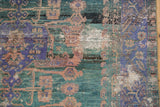 Distressed Oushak rug detail, highlighting heavy abrashes, violet, teal, and copper colors.