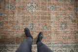 Distressed Turkish Sparta carpet, sandalwood and ivory with blue palmettes and vinery.