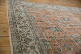 Distressed vintage Sparta carpet field and border with faded palmettes.