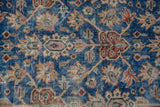 Distressed sky blue field with floral shield pattern and visible foundation wear.