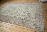 Distressed vintage Sparta carpet with mostly even wear, featuring ivory, apricot, and jade floral vinery.