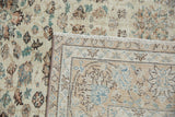Distressed vintage Sparta pile with faded lotus flowers and clear hand-knotted reverse.