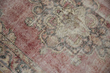 Distressed vintage Sparta runner, revealing worn pile, foundation, dusty red, cream, black pattern.